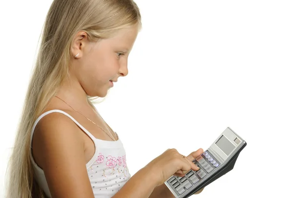 La ragazza di nove anni la bionda con la calcolatrice — Foto Stock