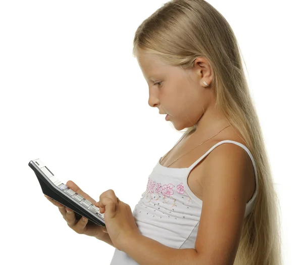 9 歳の女の子の計算機とブロンド — ストック写真