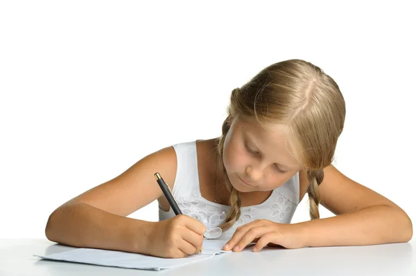 Flickan skriver till skriva-böcker. beslut av lektioner. — Stockfoto