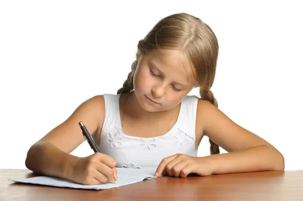 Het meisje schrijft om te schrijven-boeken. het besluit van lessen. — Stockfoto