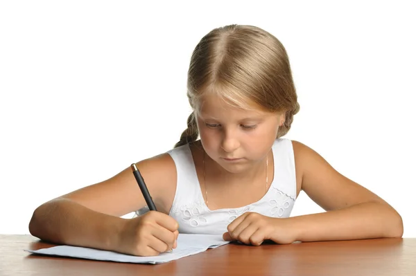 La ragazza scrive a libri di scrittura. La decisione degli insegnamenti . — Foto Stock