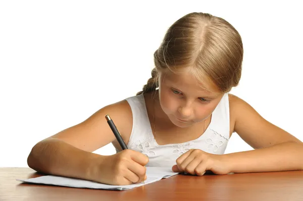 La muchacha escribe a los libros de escritura. La decisión de las lecciones . —  Fotos de Stock