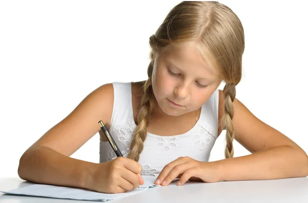 Het meisje schrijft om te schrijven-boeken. het besluit van lessen. — Stockfoto