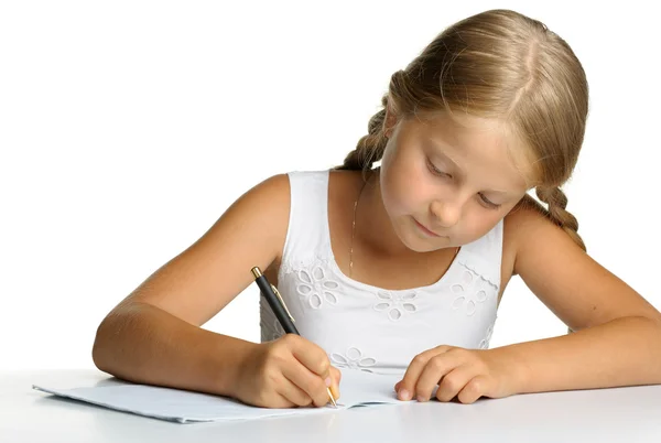 少女は本を書くに書き込みます。レッスンの決定. — ストック写真