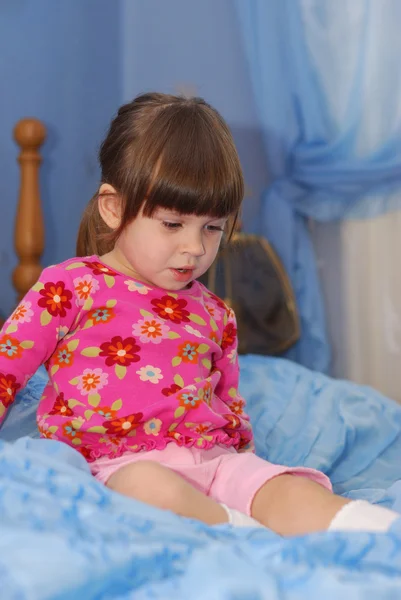 stock image The little girl on a bed