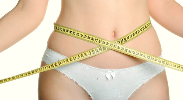 Žena urostlý tělo a měřicí pásky — Stock fotografie