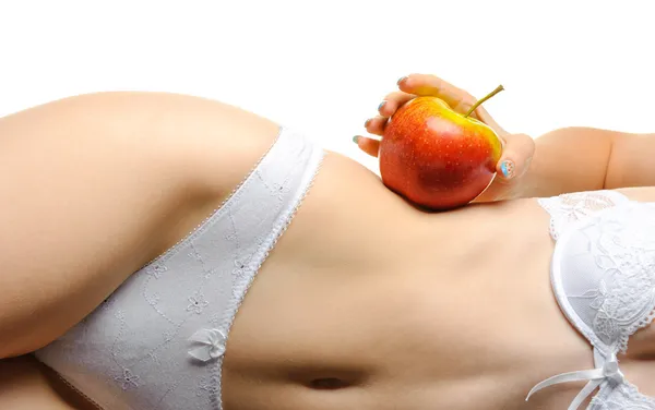 Kobieta kształtny ciała i czerwone jabłko — Zdjęcie stockowe