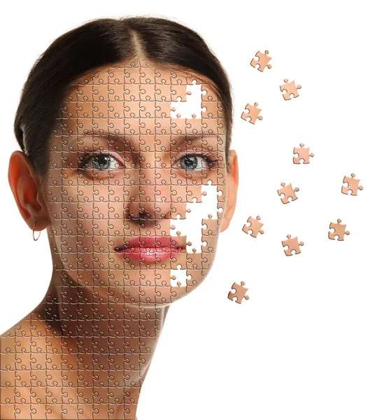 Cara femenina de cerca y detalles rompecabezas —  Fotos de Stock
