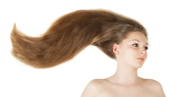 Zbliżenie zdrowy piękne długie włosy w ruch stworzony przez wiatr — Zdjęcie stockowe