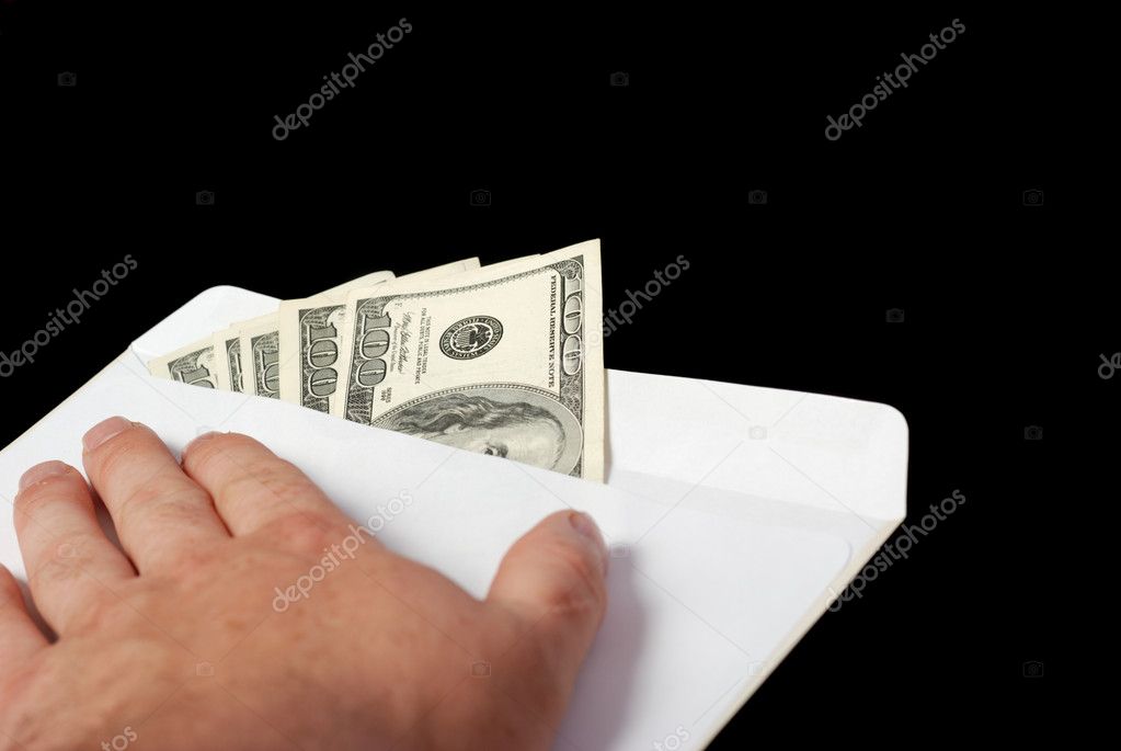 Bribe in an envelope and hand