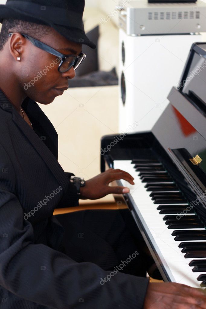 Black musician plays the piano
