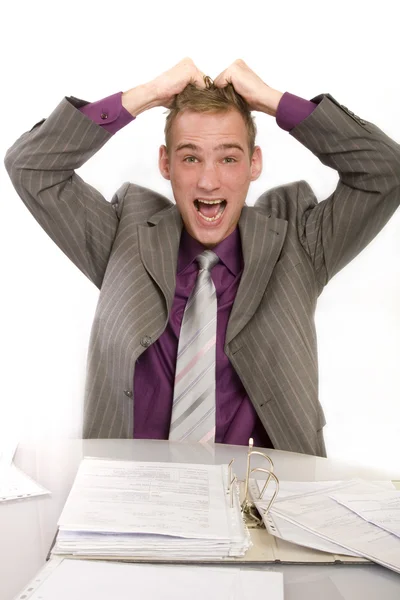 Desperate businessman at his desk in the office — Stock Photo, Image