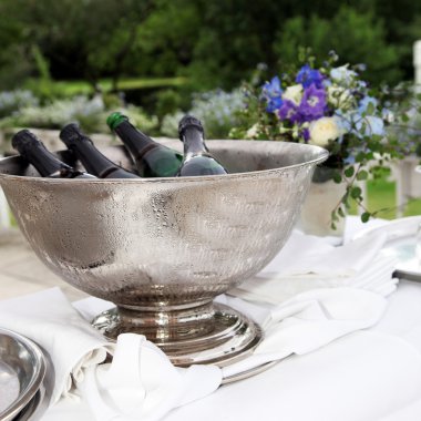 Many bottles of champagne in a champagne cooler clipart