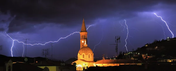 stock image Lightning over Alba and surrounding hills in Italy.