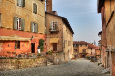 Old multicolored houses in Saluzzo, Italy. clipart