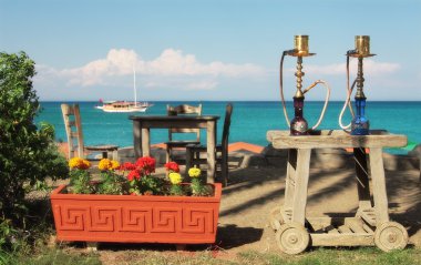 Two traditional turkish waterpipes (nargile) on the table in out clipart