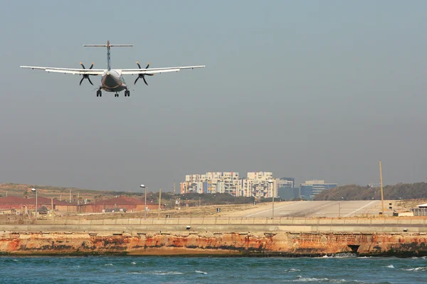 stock image Passenger airplane landing on runway.