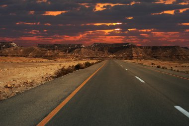 Sunset over the mountains of Ramon crater. clipart