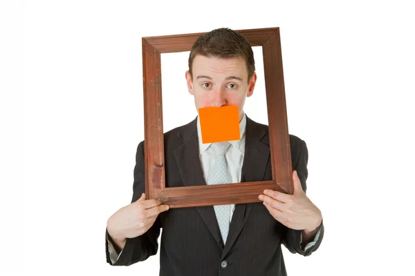 Businessman with wooden frame — Stock Photo, Image
