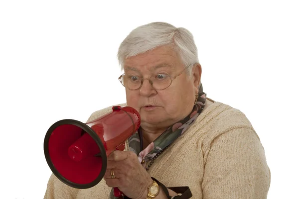 Старшая женщина с мегафоном — стоковое фото