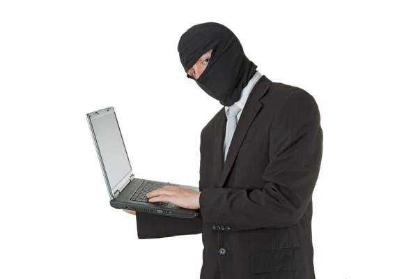 Man stealing data from a laptop — Stock Photo, Image