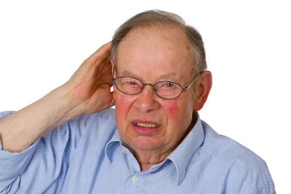 Muž senior s rukou na uchu — Stock fotografie
