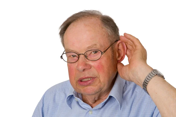 Muž senior s rukou na uchu — Stock fotografie