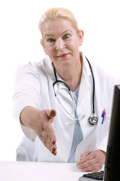 Assistente médica dá a mão para dizer olá — Fotografia de Stock