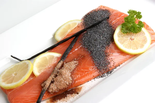 Salmon fillet on a white plate is prepared as food — Stock Photo, Image