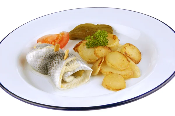 Pickled herring with fried potatoes, cucumber and tomato — Stock Photo, Image