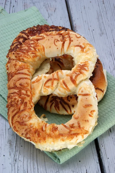 Home made cheese pretzel on a green napkin — Stock Photo, Image