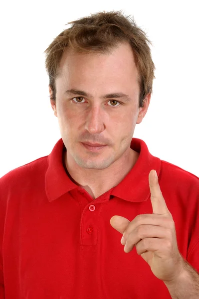 Young man in a red shirt with a raised hand — Stock Photo, Image
