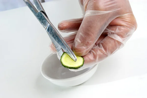 Stock image One slice of cucumber is being studied in the food laboratory