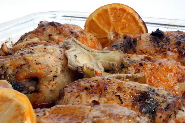 Grilled chicken thighs with orange and lemon — Stock Photo, Image