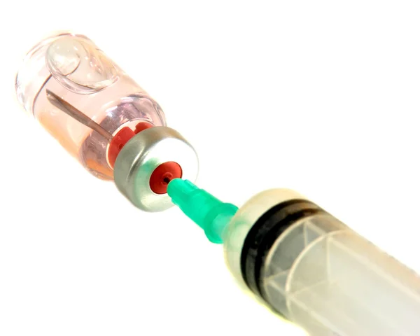 Syringe is filled with liquid from a vial — Stock Photo, Image