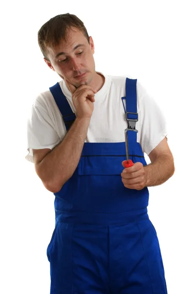 Hantverkare håller en skruvmejsel i handen — Stockfoto