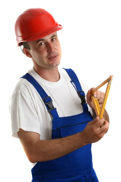 Handwerker bei der Arbeit mit einem gelben Lineal — Stockfoto