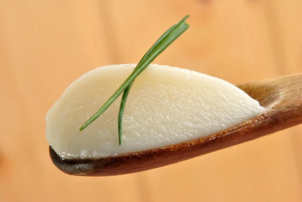 Homemade goose lard on a wooden spoon — Stock Photo, Image