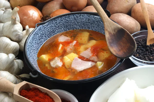 Meat and potatoes cooked in a small pot — Stock Photo, Image