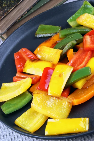 Sliced ??and grilled organic peppers on a pan — Stock Photo, Image