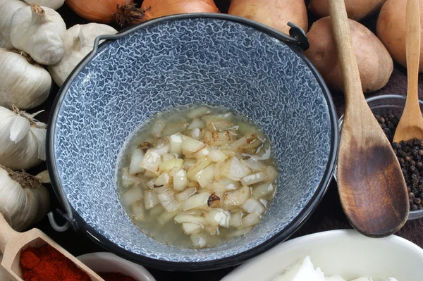 Onions and garlic are sauteed — Stock Photo, Image