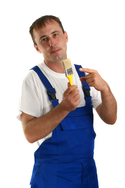 Ambachtsman met een gele penseel in zijn hand — Stockfoto
