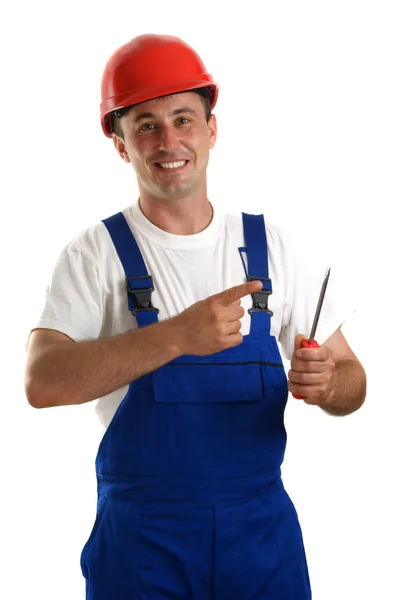 Craftsmen with helmet is holding a screwdriver in his hand — Stock Photo, Image