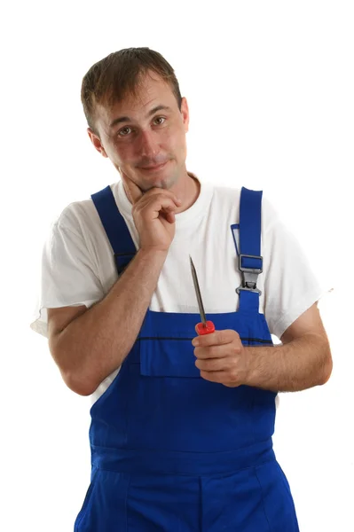Craftsmen is holding a screwdriver in his hand — Stock Photo, Image