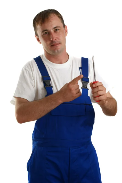 Craftsmen is holding a screwdriver in his hand — Stock Photo, Image