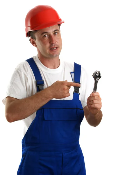 Artesãos em roupas de trabalho segurando uma chave ajustável — Fotografia de Stock