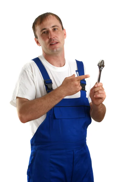 Artesanos con ropa de trabajo sosteniendo una llave ajustable —  Fotos de Stock