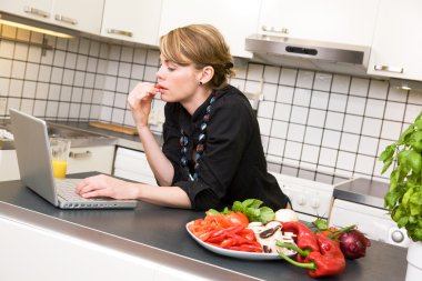 Lunch in Kitchen with Laptop clipart