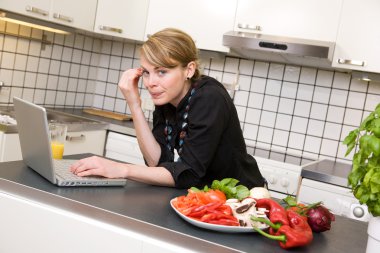 Lunch in Kitchen with Laptop clipart