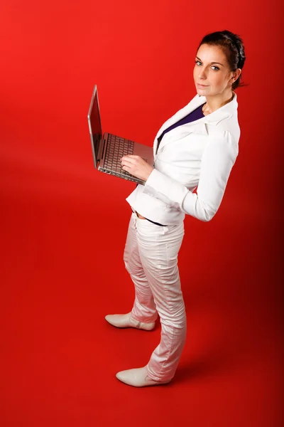Female with Computer on Red — Stock Photo, Image